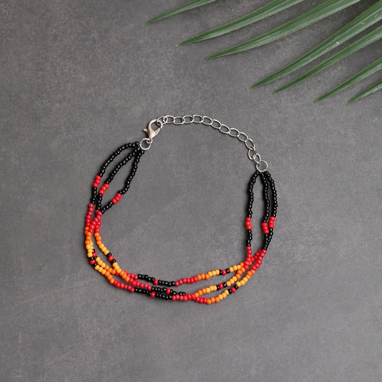 Sunset Harmony Beaded Bracelet – Bold Red, Orange, Yellow, and Black Strands