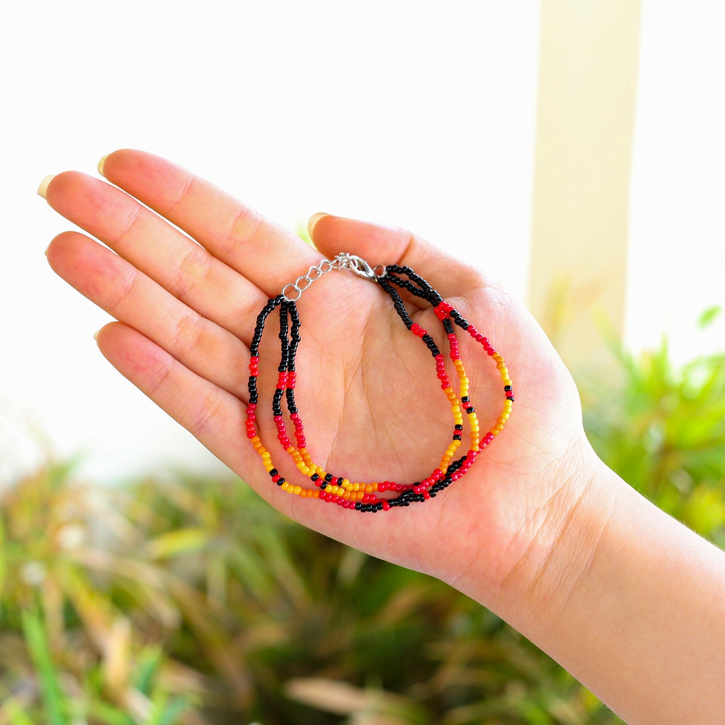 Sunset Harmony Beaded Bracelet – Bold Red, Orange, Yellow, and Black Strands