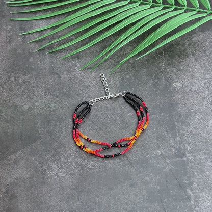 Sunset Harmony Beaded Bracelet – Bold Red, Orange, Yellow, and Black Strands